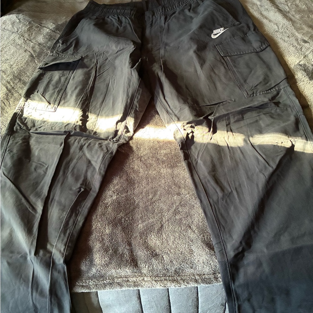 Nike Dark Black Cargo Pants. Size XL. With Drawstring at Waist for a great fit.